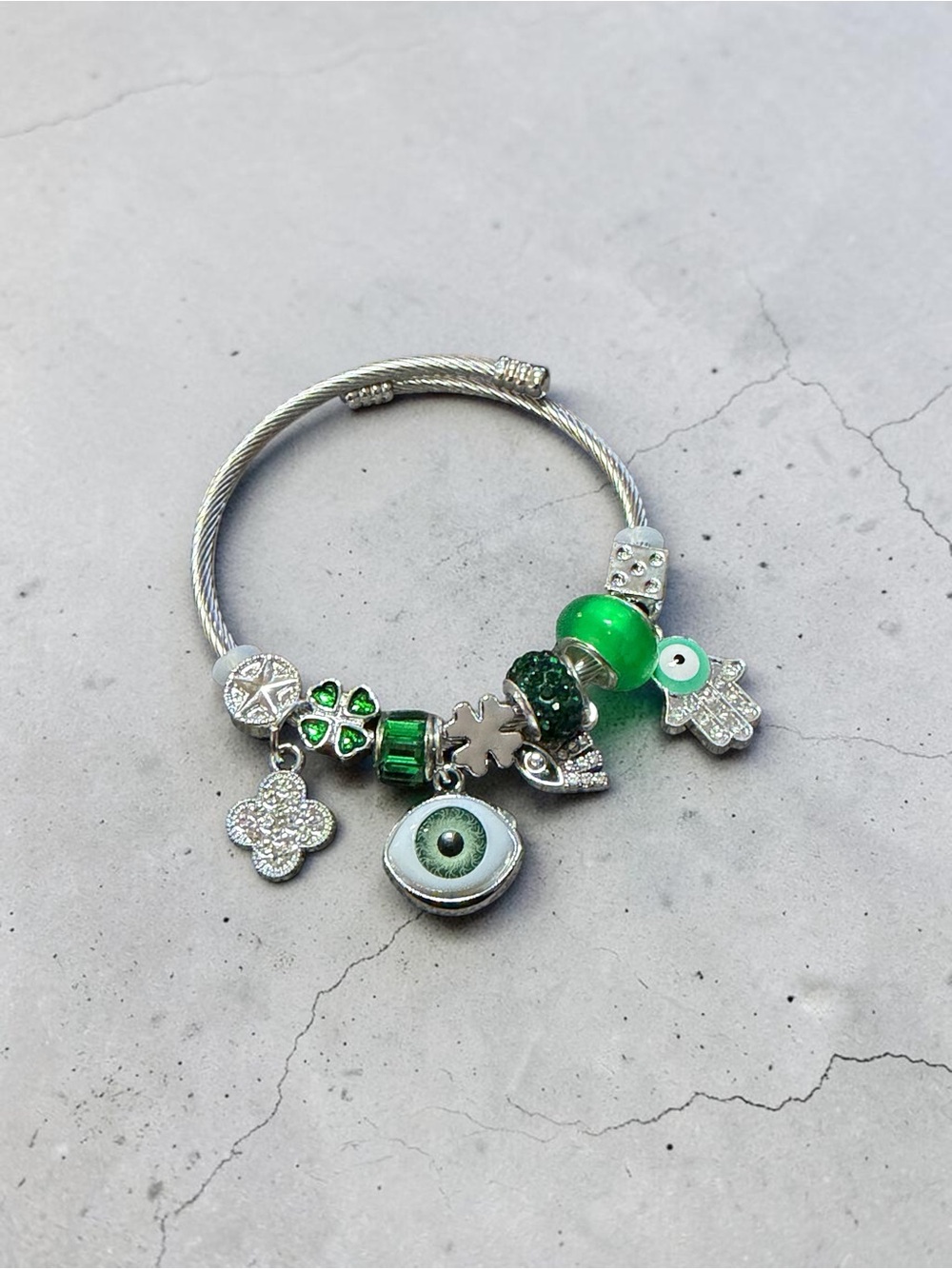 Silver Charm Adjustable Twisted Bangle with Green Glass Beads and Eye Charm